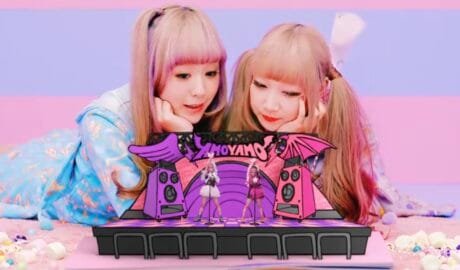Two girls with colorful background and stage amoyamo let's go out music video video japanese japan